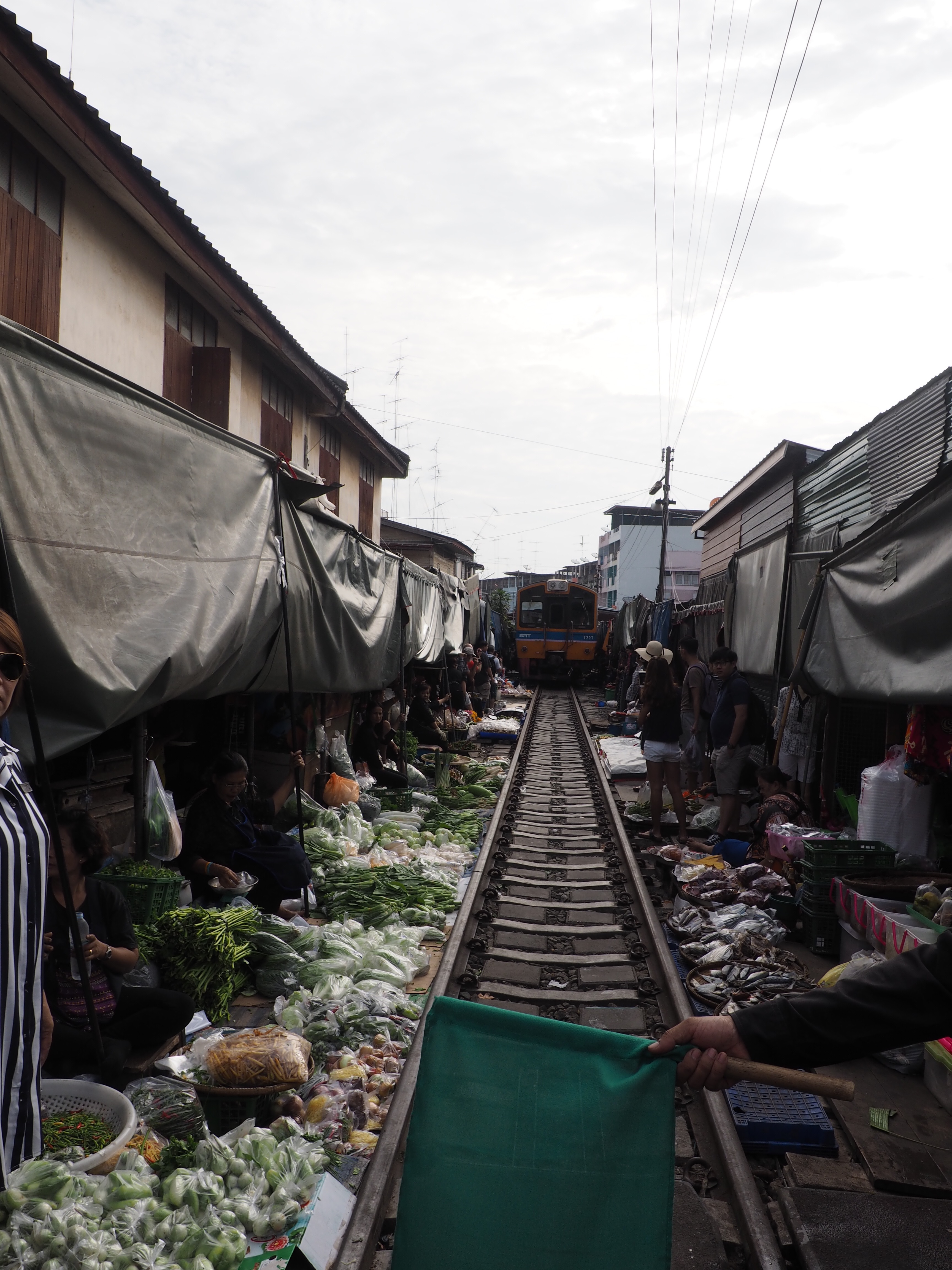 Thailand's Maeklong Railway Market: a market on an active railway travel | Shades of Pinck